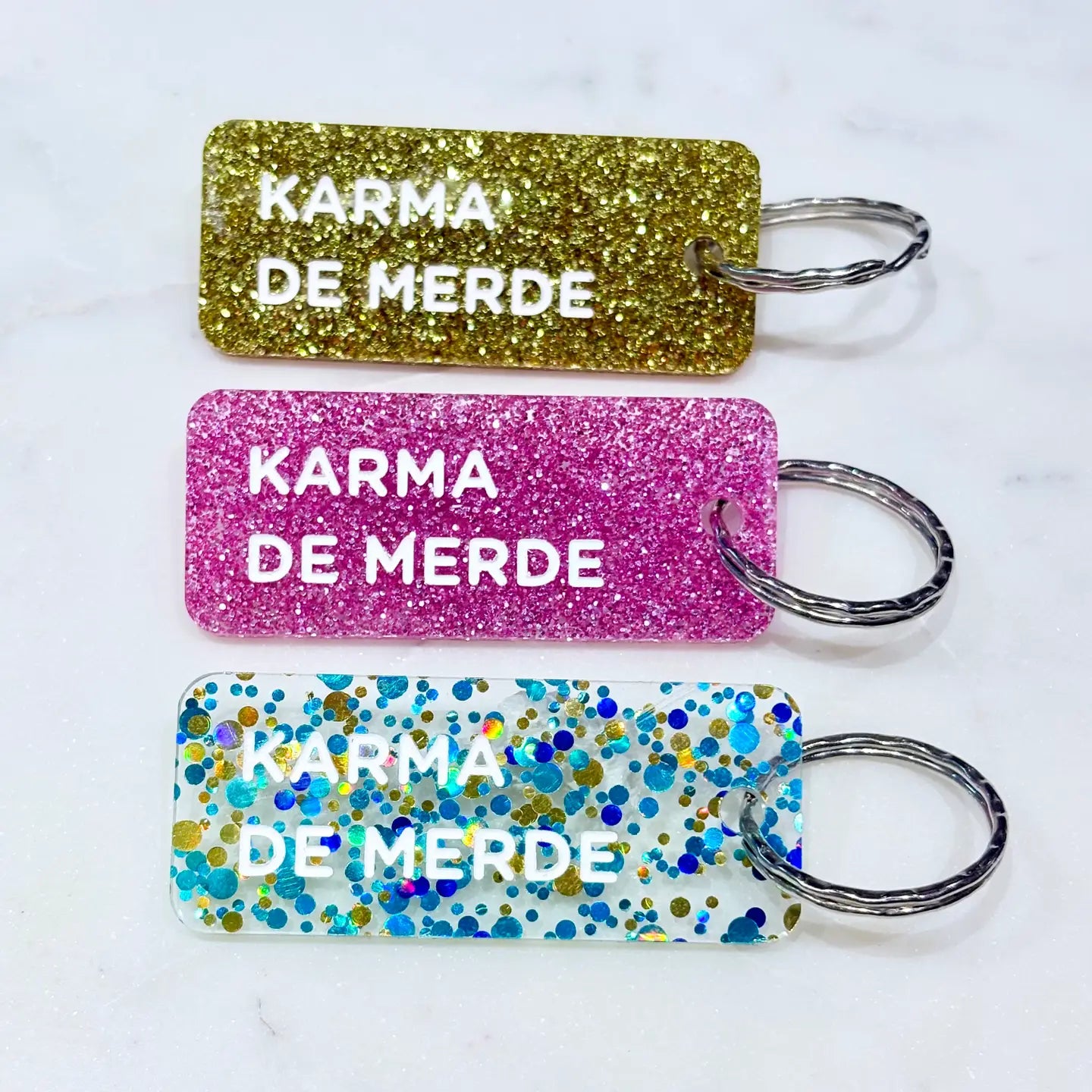 KARMA DE MERDE Porte-clés à paillettes Bleu/Or/Vert